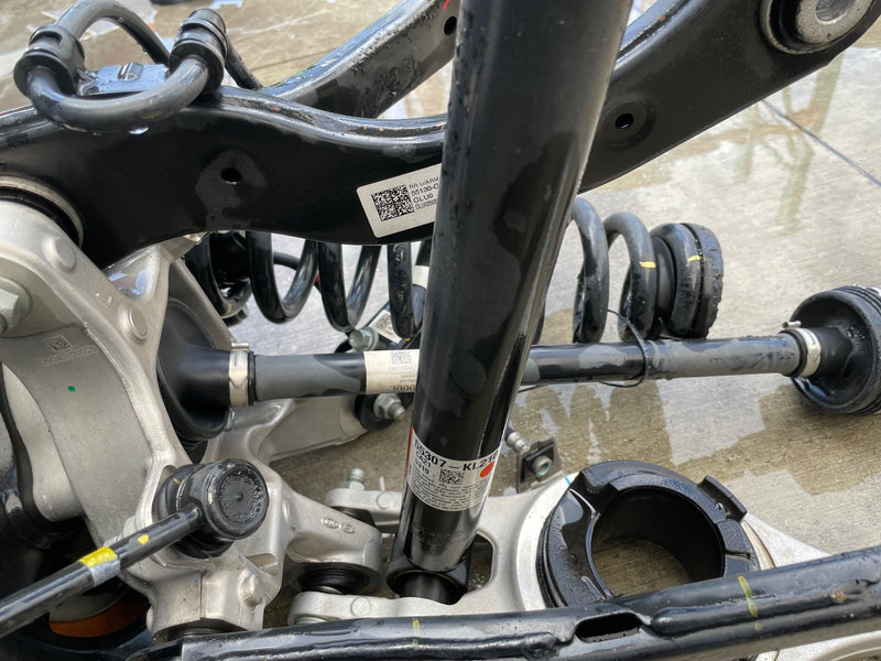 Load image into Gallery viewer, 2023-2025 HYUNDAI IONIQ 6 RWD REAR LEFT SIDE SUSPENSION KNEE ASSEMBLY # 112322