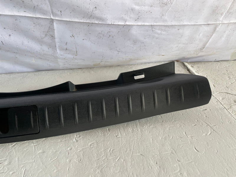 Load image into Gallery viewer, 2021-2026 GENESIS G70 REAR TRUNK LATCH LOCK SILL SCUFF PLATE TRIM COVER # 108140
