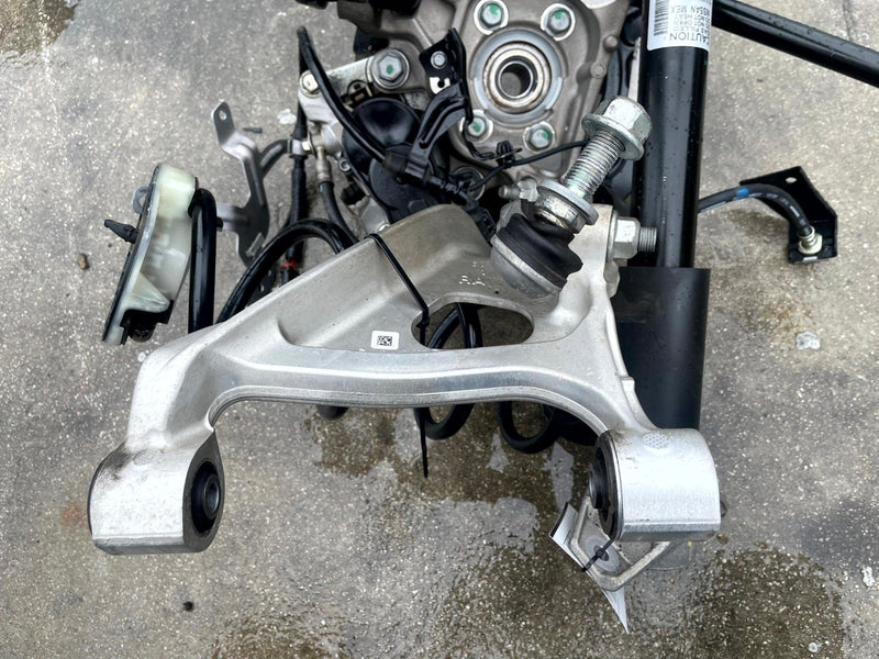 Load image into Gallery viewer, 2021-2025 NISSAN ROGUE AWD REAR RIGHT SIDE SUSPENSION KNEE ASSEMBLY # 106873
