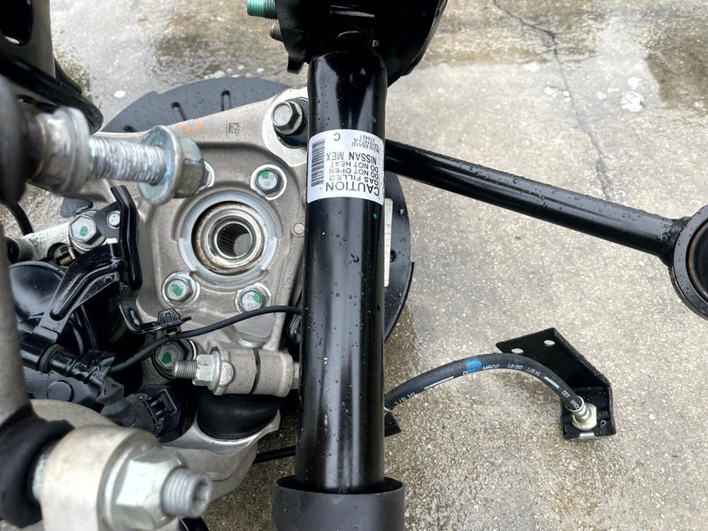 Load image into Gallery viewer, 2021-2025 NISSAN ROGUE AWD REAR RIGHT SIDE SUSPENSION KNEE ASSEMBLY # 106873
