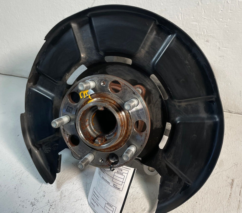 Load image into Gallery viewer, 2020-25 KIA TELLURIDE FWD REAR LEFT SIDE SPINDLE KNUCKLE W/ BEARING HUB # 107142
