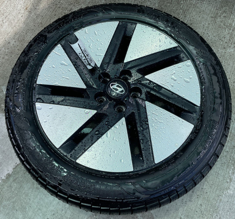 Load image into Gallery viewer, HYUNDAI IONIQ 6 18x7.5 BLACK 7-SLOT ALLOY WHEEL RIM W/TIRE (ONLY#1) 23-25 112313
