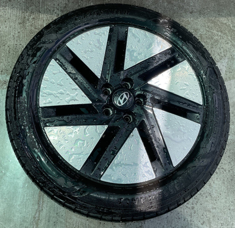 Load image into Gallery viewer, HYUNDAI IONIQ 6 18x7.5 BLACK 7-SLOT ALLOY WHEEL RIM W/TIRE (ONLY#1) 23-25 112314
